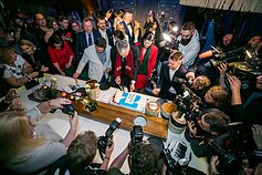 Gitanas Nausėda cuts victory cake in his campaign headquarters on Sunday night