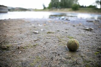 As the water levels dropped, trash and other objects were revealed on the river bed 