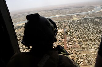 A French soldier stands inside a military helicopter during a visit by French President Emmanuel Macron to the troops of Operation Barkhane in Mali. Estonian troops serve alongside the French forces