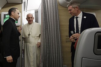 Pope Francis on the plane to Thailand and Japan, before heading back to Rome