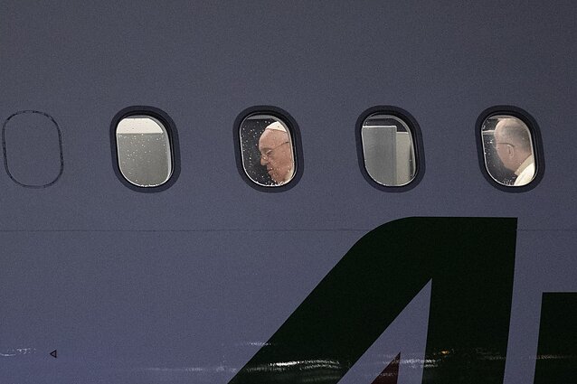 Pope Francis on the plane to Thailand and Japan, before heading back to Rome