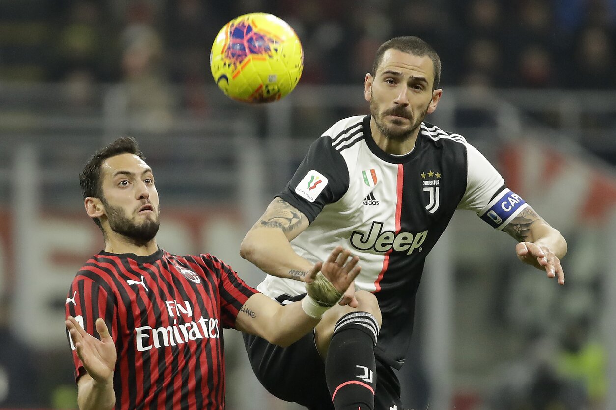 Hakanas Calhanoglu ir Leonardo Bonucci