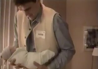 Arvydas Sabonis is holding his new-born son, Domantas.