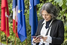 Esther Shalev-Gerz inspects her Lithuanian passport
