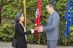 Esther Shalev-Gerz receives a Lithuanian passport from Ambassador Nerijus Aleksiejūnas