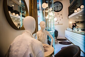 Mannequins fill empty tables in Vilnius’ cafes to keep physical distance.