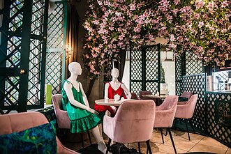 Mannequins fill empty tables in Vilnius’ cafes to keep physical distance.
