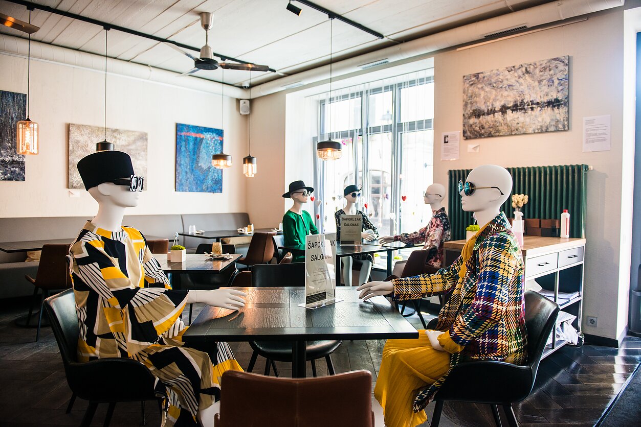 Mannequins fill empty tables in Vilnius’ cafes to keep physical distance.