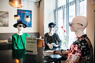 Mannequins fill empty tables in Vilnius’ cafes to keep physical distance.