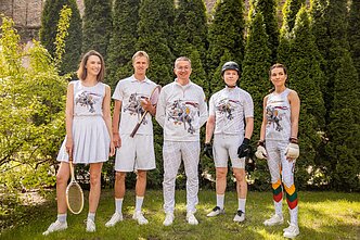 Fashion designer Aleksandras Pogrebnojus, centre, with his "alternative" olympic designs