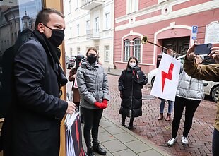 Women's rights activists protest in Vilnius during Polish president's visit