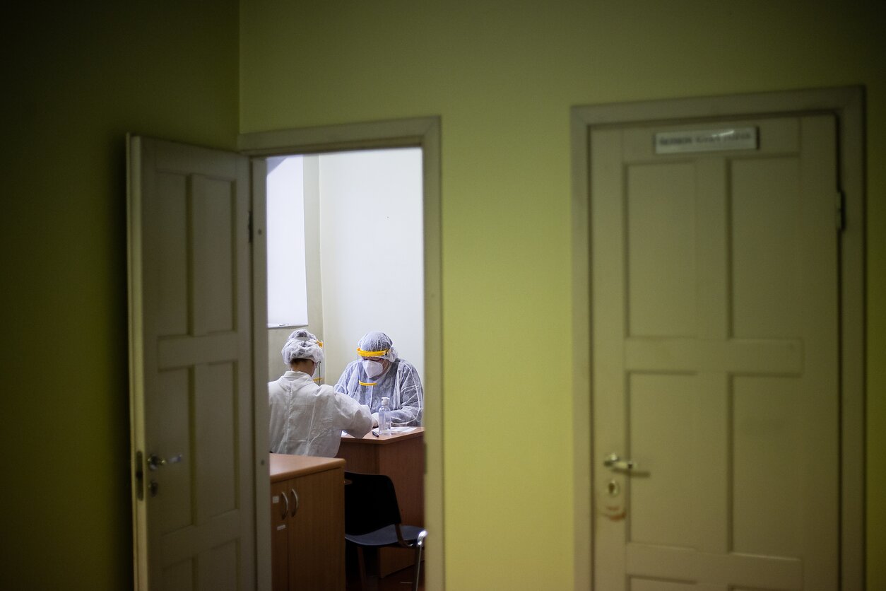 Medics inside a room where some 30 inmates are tested every day,