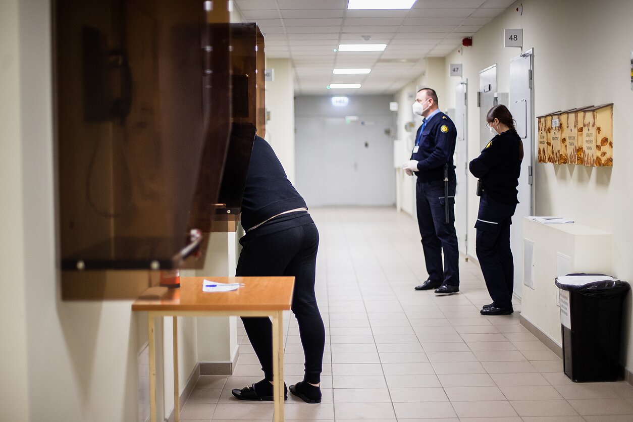 An inmate is talking to his family on the phone