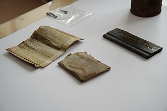 Researchers discover gas mask bag in Lithuania containing partisan documents.