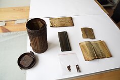 Researchers discover gas mask bag in Lithuania containing partisan documents.