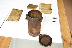 Researchers discover gas mask bag in Lithuania containing partisan documents.