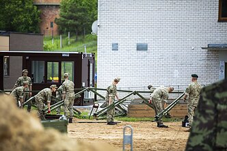 Lithuania builds temporary refugee camp, may declare emergency over irregular migration