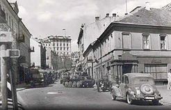 Buildings decorated with the Lithuanian tricolor flags during the June Uprising in Vilnius, Lithuania, 1941. The German soldiers with their military equipment are visible in the city's street.