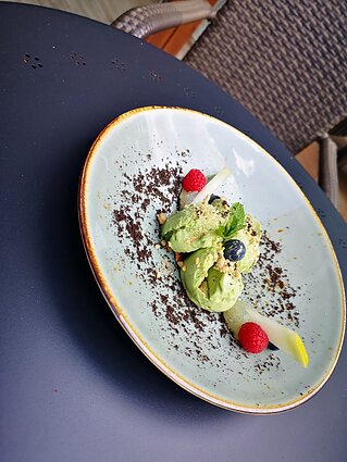 Avocado ice cream with melon pure.