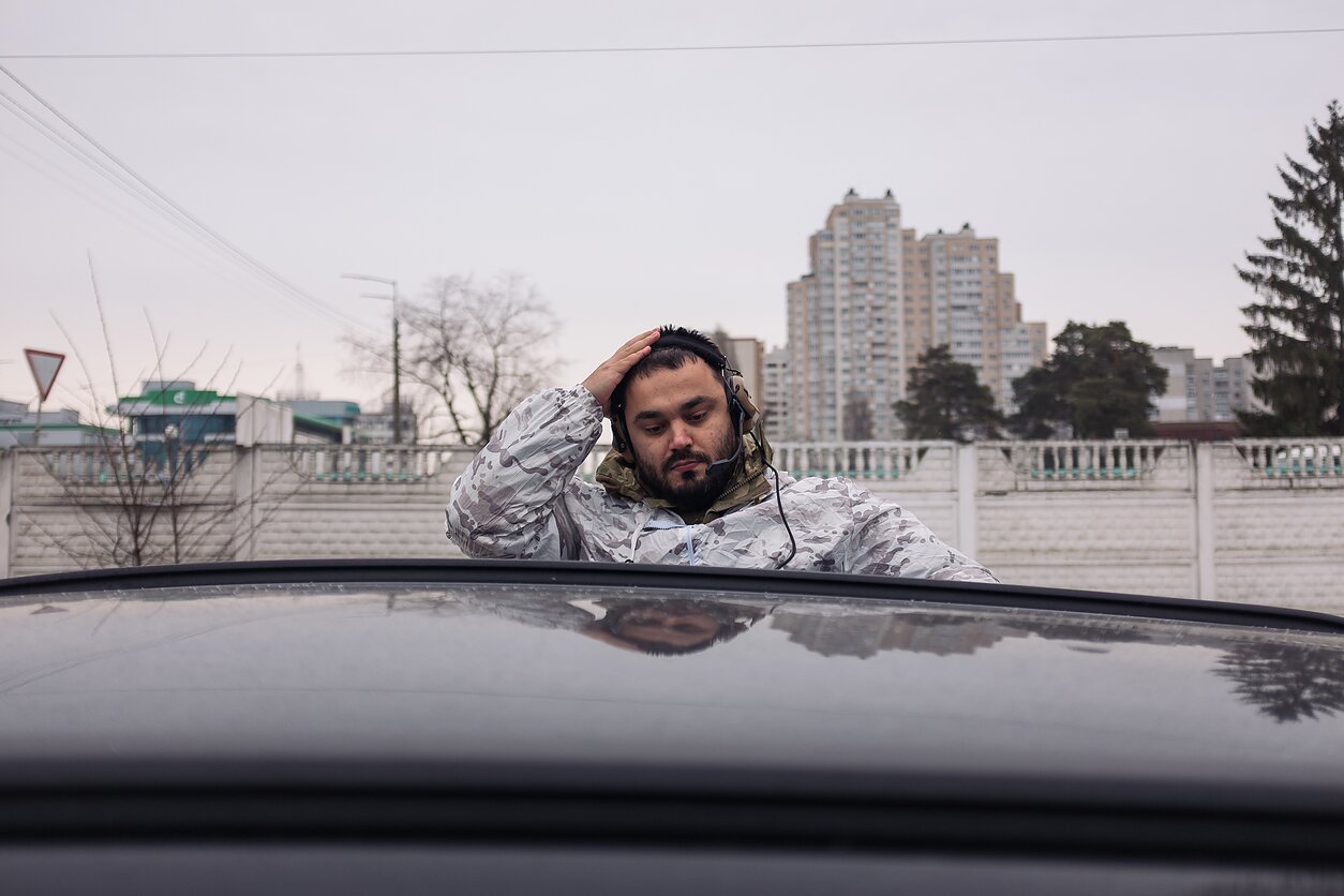 After arriving at the rallying point on the outskirts of Kyiv in the early morning, member of the Ukrainian Territorial Defence Force prepares for drills in a nearby forest