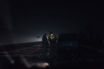 Two operatives exchange intelligence information.