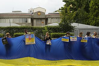 People in South Africa protest against Russia's invasion of Ukraine.