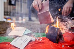 Belarusians burn their passports outside the Ukrainian Embassy in Vilnius Belarusians burn their passports outside the Ukrainian Embassy in Vilnius