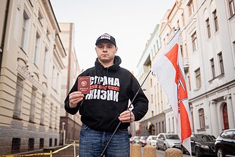 Belarusians burn their passports outside the Ukrainian Embassy in Vilnius Belarusians burn their passports outside the Ukrainian Embassy in Vilnius
