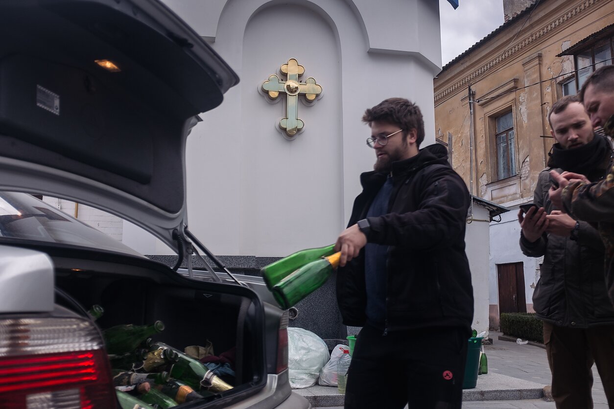 Ukrainians collect bottles to be used for making Molotov cocktails