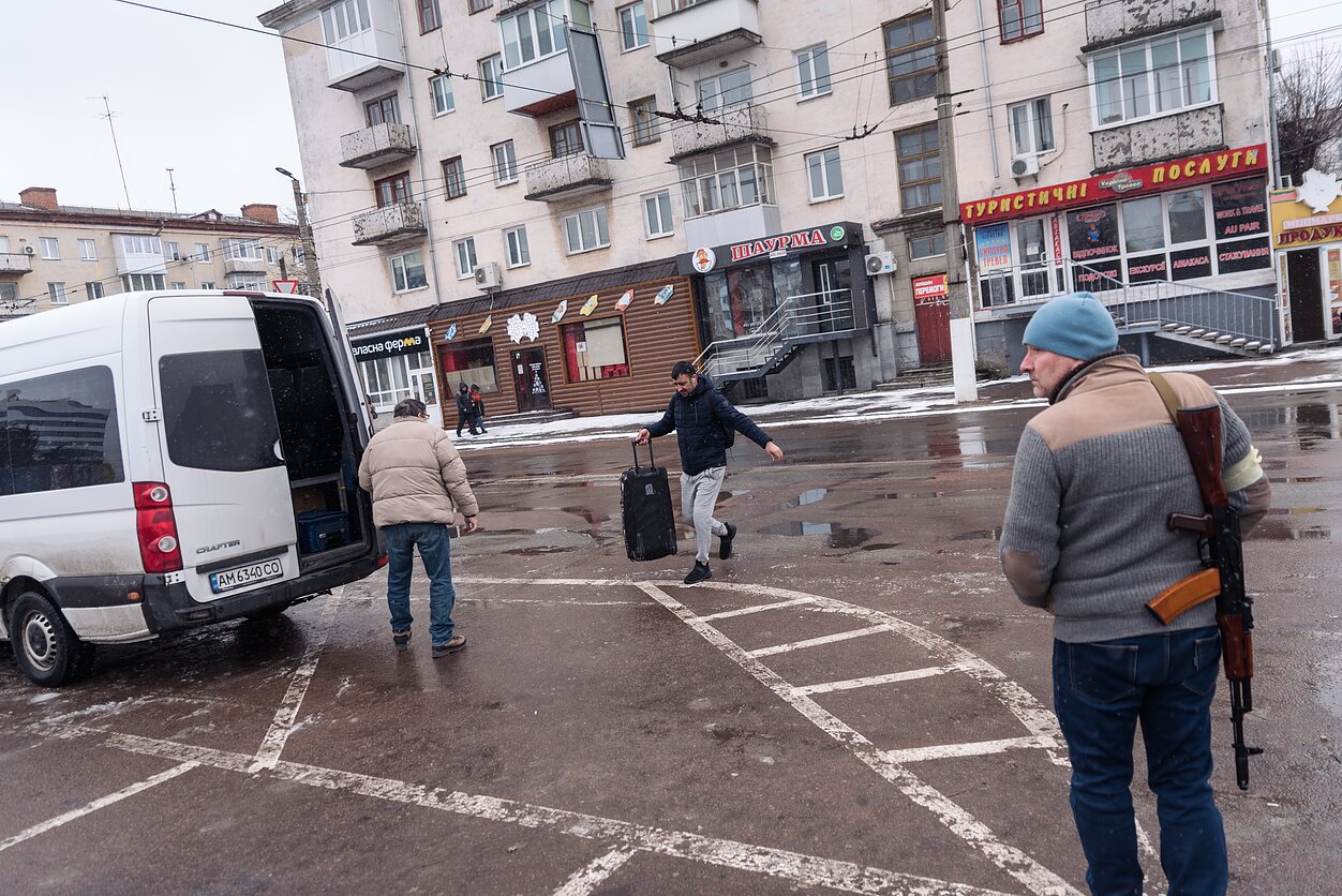 People flee Zhytomyr, the first city west of Kyiv, as the Russian advance continued.