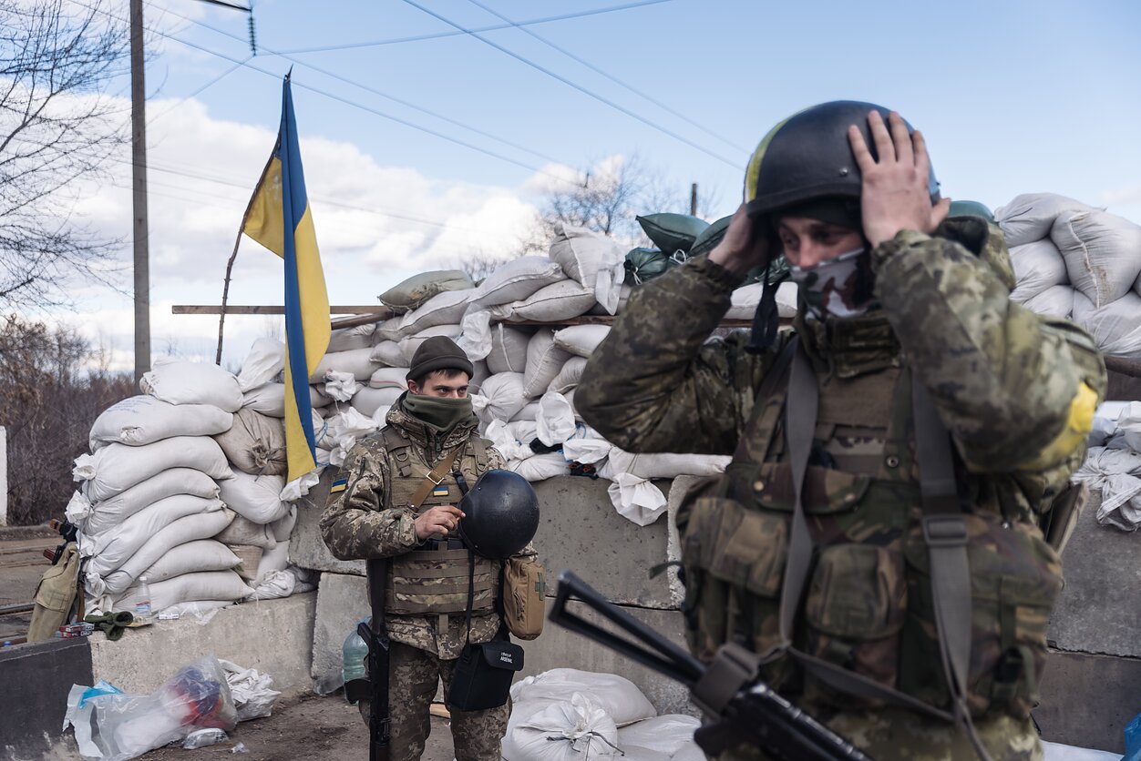 Fortifications appeared all across Ukraine, with civilians and various branches of the military, including the border guards pictured here, standing ready.