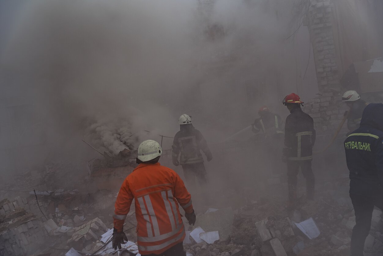 A school in Zhytomyr, west of Kyiv, was hit on March 4. As the firefighters extinguished the fire, teachers and the director tried to rescue what was left of the text books.