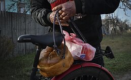 A local resident with humanitarian aid, Donetsk region, December 2022