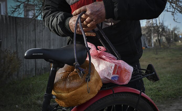 A local resident with humanitarian aid, Donetsk region, December 2022