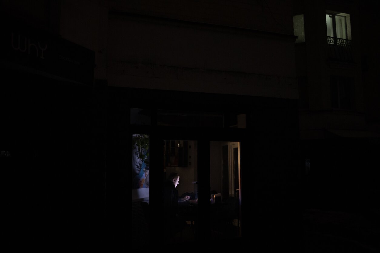 A man works on his laptop amid a blackout. A cocktail bar has rebranded itself as a coworking space, bringing workers from the area together. The blackouts now are just “another sign” of what Ukraine can expect amid Russia’s attacks against civilians, says Dasha, who established a coworking space in this cocktail bar. “I have no illusions it will become easier, but nothing is scary anymore,” she adds. A man works on his laptop amid a blackout. A cocktail bar has rebranded itself as a coworking space, bringing workers from the area together. The blackouts now are just “another sign” of what Ukraine can expect amid Russia’s attacks against civilians, says Dasha, who established a coworking space in this cocktail bar. “I have no illusions it will become easier, but nothing is scary anymore,” she adds.