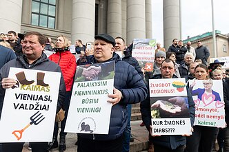 Lithuanian dairy farmers stage a protest outside the parliament in Vilnius