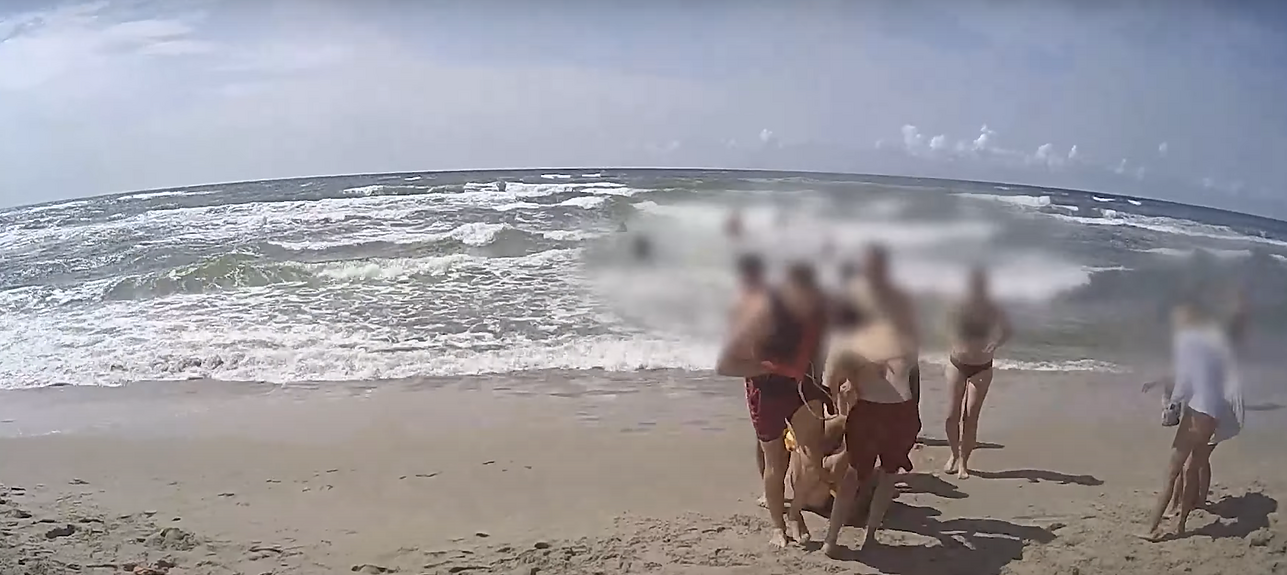 Officers, bystanders and air force save drowning tourists from Baltic Sea – video