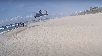 Officers, bystanders and air force save drowning tourists from Baltic Sea – video