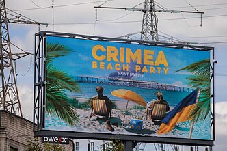 Ukraine supporters display ‘Crimea Beach Party’ billboards during NATO summit in Vilnius