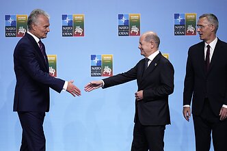 Gitanas Nausėda, Jens Stoltenberg, and German Chancellor Olaf Scholz Gitanas Nausėda, Jens Stoltenberg, and German Chancellor Olaf Scholz