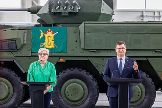 Defence Minister Laurynas Kasčiūnas, right, and Prime Minister Ingrida Šimonytė