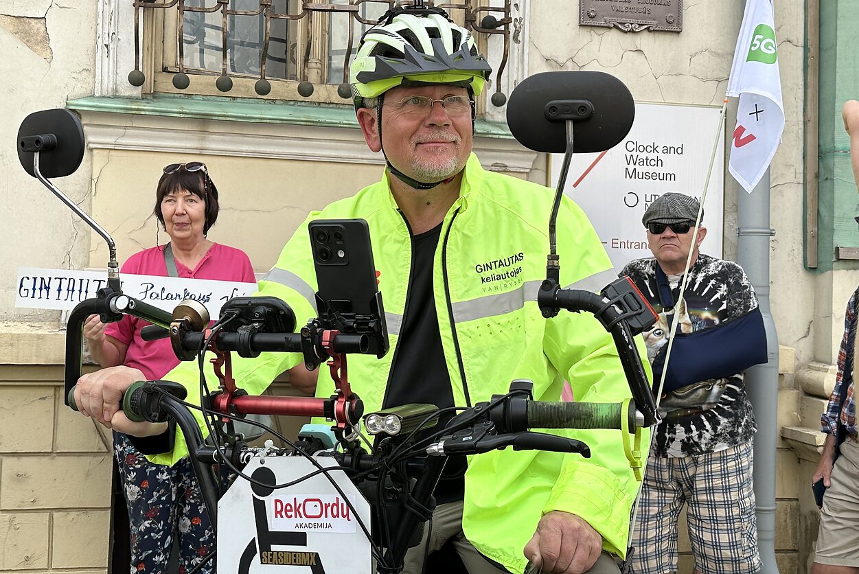 Photos from Markevičius' previous record show him embarked on a challenge to cycle around Lithuania on an electric tricycle. Photos from Markevičius' previous record show him embarked on a challenge to cycle around Lithuania on an electric tricycle.
