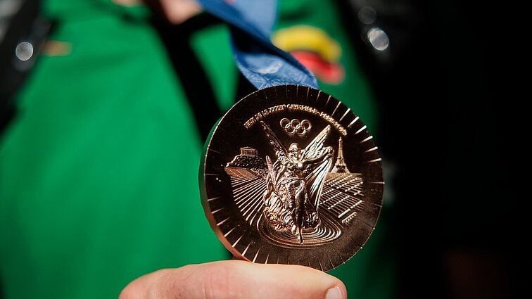 Kokio dydžio premijas gaus olimpinius medalius iškovoję sportininkai?