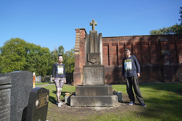 Aistė and Augustinas in a Lithuanian cemetery, Manchester, UK