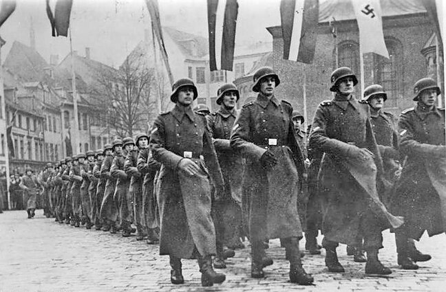 Latvian SS division parade through Riga before deployment to Eastern Front. December 1943