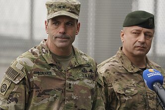 Christopher Donahue (left)