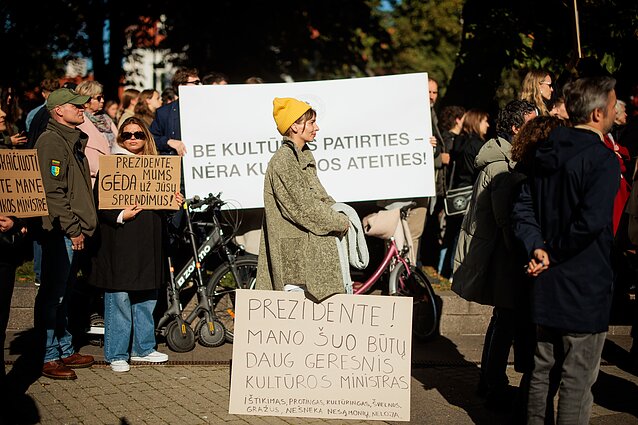 Protesters carrying placards reading: “President, my dog would make a better culture minister” and “President, we are ashamed of your decisions.”