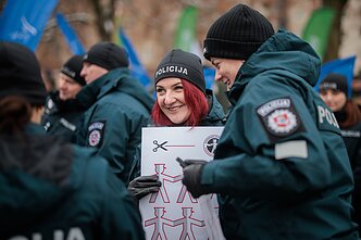 Several hundred law enforcement officers rallied outside the Lithuanian parliament Several hundred law enforcement officers rallied outside the Lithuanian parliament