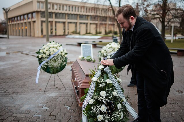 Several dozen young people gathered outside the Seimas on Friday morning in a symbolic funeral protest