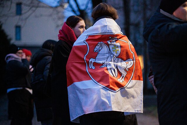 People greet released political prisoners in front of the US embassy in Vilnius.
